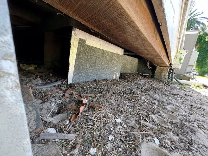Dirty Ground Entrance to Crawl Space under Florida Mobile Home House