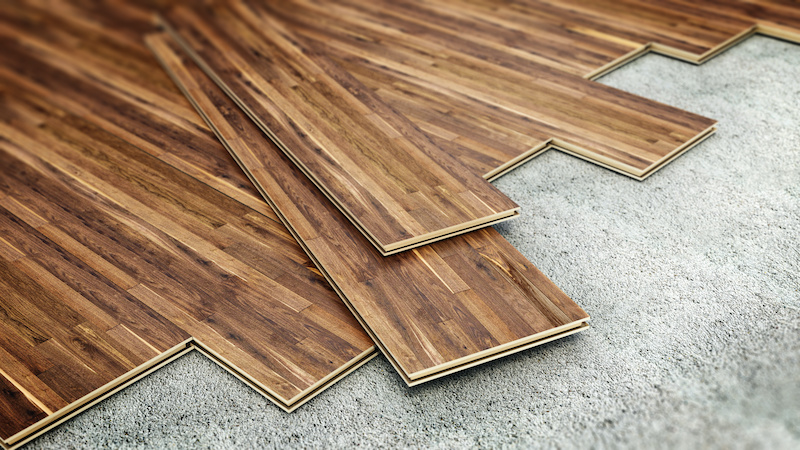 Laminated floor tiles installation. 3D illustration.