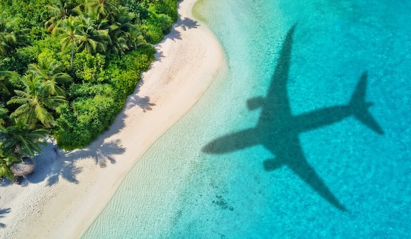 Travel concept with airplane shadow and tropical beach. Tropical paradise and beach holiday conceptual image. SSUCv3H4sIAAAAAAAAE0WQ226DMAyG38XXIAiEcniITWovq16YxHRRaVIlgWlCvPscsWp3Pny/f9sb4KKNg2GD1SmcAwz1nsGIwahUJG2i8wZnGMoMzDwvIXqMxlkuMKgw0p0BConGO1n1w9H/iOuWGBjgA+PiCTIIy8jphbD4VIS2OJuVPOzZG7y8nI+hOJPydDi9NbDfkiWv4J6HiWZ7boha1I0ou7YVvSybXtasMTp1ugkrbEUuhTzlUssq73oUeV/1zXiiUYsysY/vSP4ZjqHWxXQOcN3FL96NL/NkdYomfhEx8/JGGXs/BJ5mwpA01xvvGvnScDxEVLWfYBAscFY3HO0JcOph9J/bajSl/+/7L3keN+KMAQAA