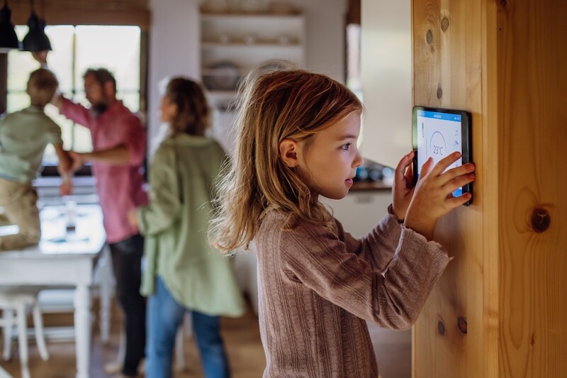 Girl looking at the smart thermostat at home, checking heating temperature. Concept of sustainable, efficient, and smart technology in home heating and thermostats. SSUCv3H4sIAAAAAAAACnRTyY7UMBC9I/EPrZyx5N0xf8ABceGGOJSXdJtxx63EGRi1+t9x1vGg4ZTUe+VX+/3jh9OpMTAG23w+3Wer2CHGacwD5JD6AuNPGz743vmhRp4HJnENQKgt70JOQ4BYgwayvfRw9QXspxhn+LGQzZghT6Mfq1zGy5SzH8ac7FOBya7iBg/XMYdF5kBtimkaTPpTgxDh+lIDt9Q7MQNVaAvZn0uub4Lvjfmx2qedWGNBLlTzpS/phTSMzSa/pj2Zmfxmfnmbx2Zn1mD/UfruS19KAeeX96S+htH6GKH3aaoE15+fR61n39u52PujKm7w0cPa162UhnFoLUiBvJeAuNQGadwZRKlSRDBpLIM9jQYE76S1GimiGeLKemTKO+TBtNzRtqDqcLakY6TII+/AIN5yi1rJORKWGk2E6kRHD2dBNNUgACkwAnEq7KyMkWGdx5zr1il9OGNrOJHEIzCdRLwrL6BjHmFhvQCMqevsaxoYCy0FReXrEGeWlwK9RUIqI4WgnaZ2aePau+bpd5njdZn+1jWYXEjVNjwnC3F2YFVrIdxggDfvbkOwoT9XSMqX5W52JZumPg/zmJoj35jSDUyc17krYfyOX2Aci7vb8Xpny5WmaxWnT3kZ8qbauLLUs0kYK72UgmmhmGyVwk19cJdQdJZ07lvQ6RYTOD8H3aB3TlFhzDVhRBzb+s9Vrg5S01eHNwf6Dn/c6s5V4sfZHtxK1Zu+JBdcPY4wV9FI4nxriVq3nIuWI+PKklJqaIcVlH9S1uHxFwAA//8DAMqELaMSBQAA