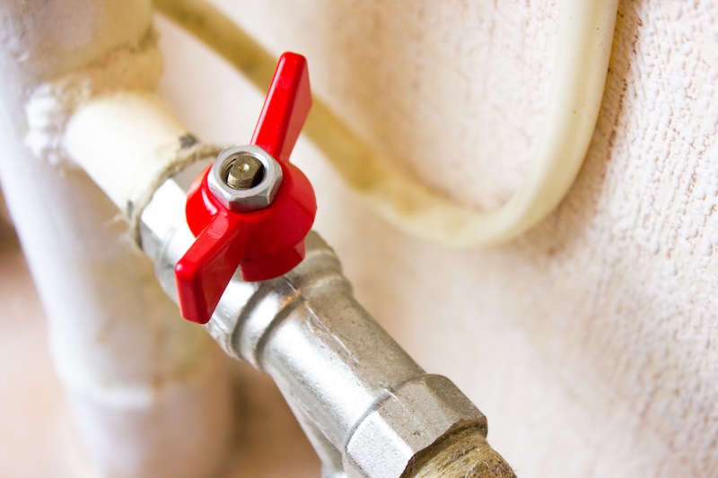 Valve on the water supply pipe. Plumbing valve, metal tap.