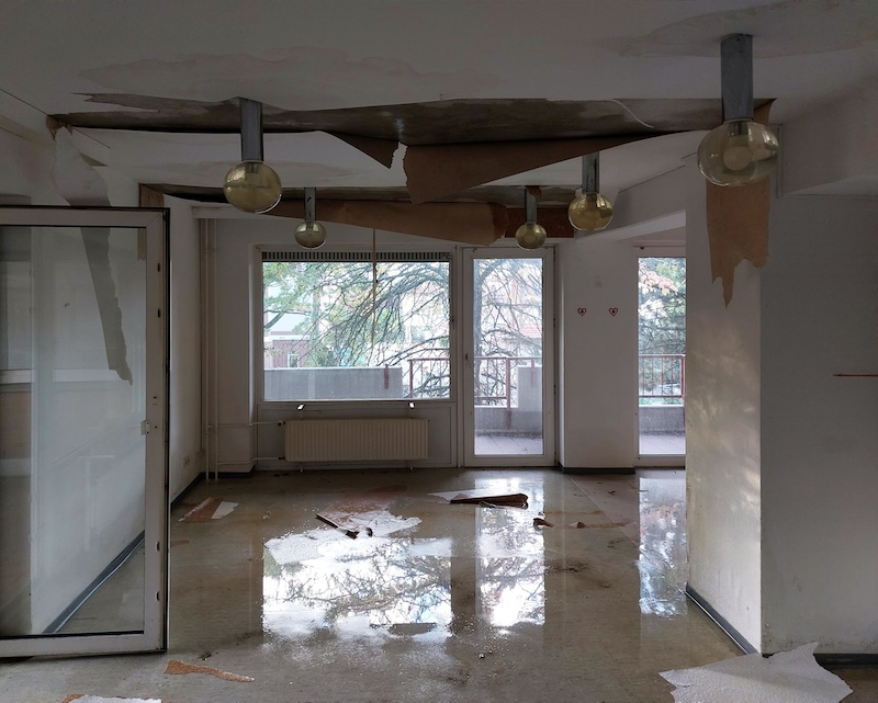 Water damage in interior room of abandoned building.
