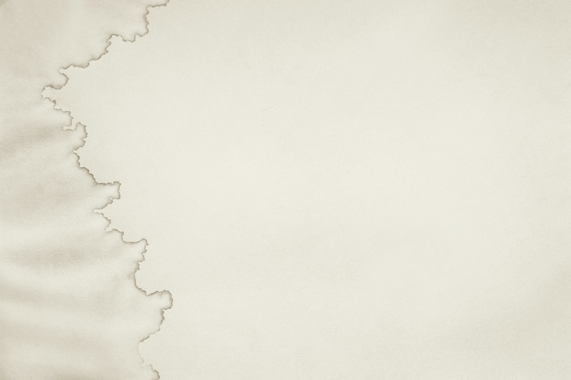 Wet stained paper background. Paper texture with water stains